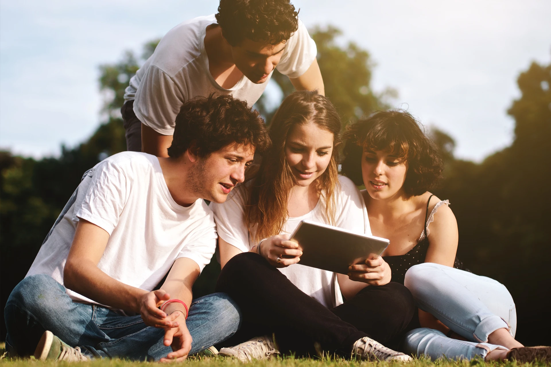 Young students siting and reading Sunrise Alliance Newsletter Young students siting and reading Sunrise Alliance Newsletter